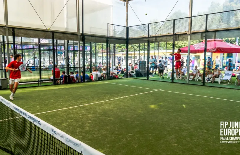 Playing on the court at Premier Padel Nagyrét